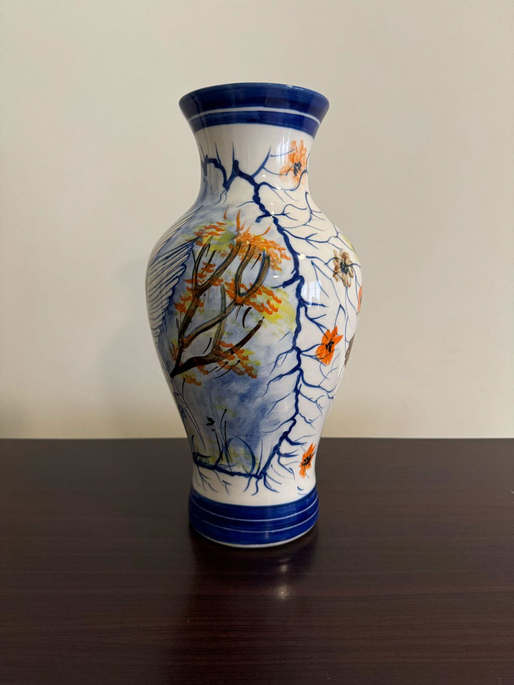 Decorative vase with floral design on a plain background