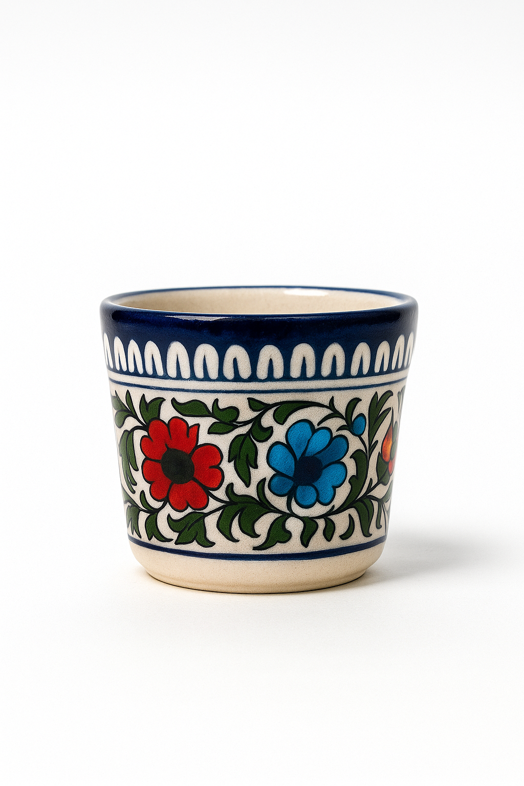 Ceramic cup with floral design on a white background
